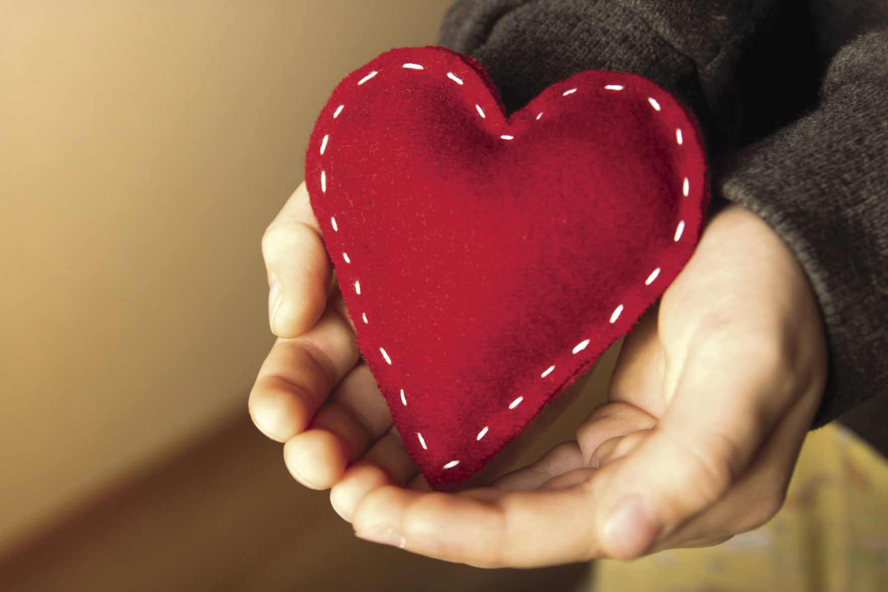 Red heart in hands
